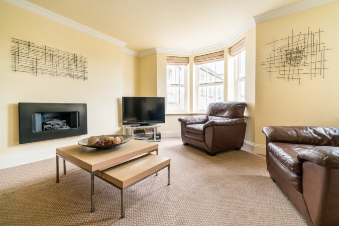 The Landings, Whitby. Large living room with flat screen television and leather sofas
