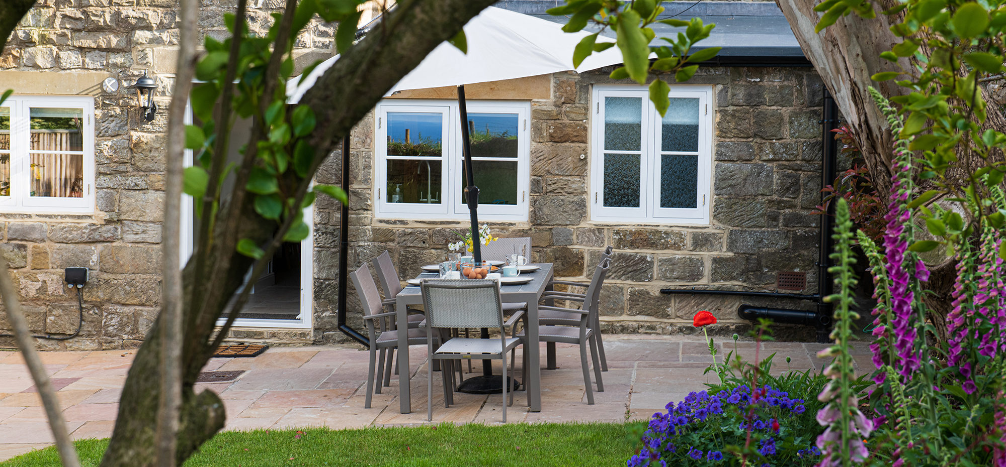 Eat al fresco in this wonderful garden at Chapel Cottage in Lythe