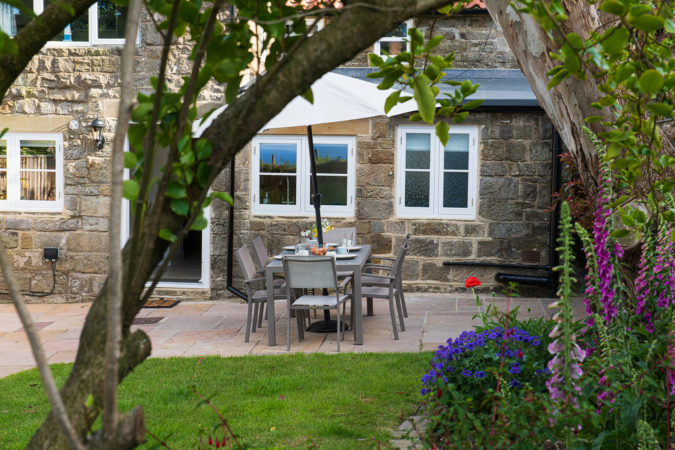 Eat al fresco in this wonderful garden at Chapel Cottage in Lythe