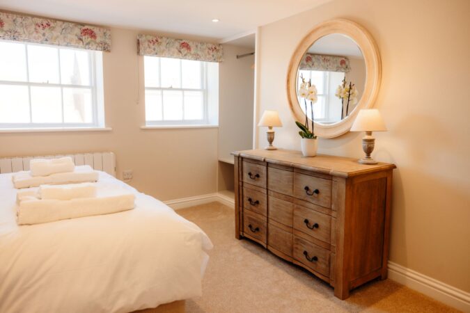 Bright and airy king-size bedroom with rooftop views from the second floor at The Hideaway
